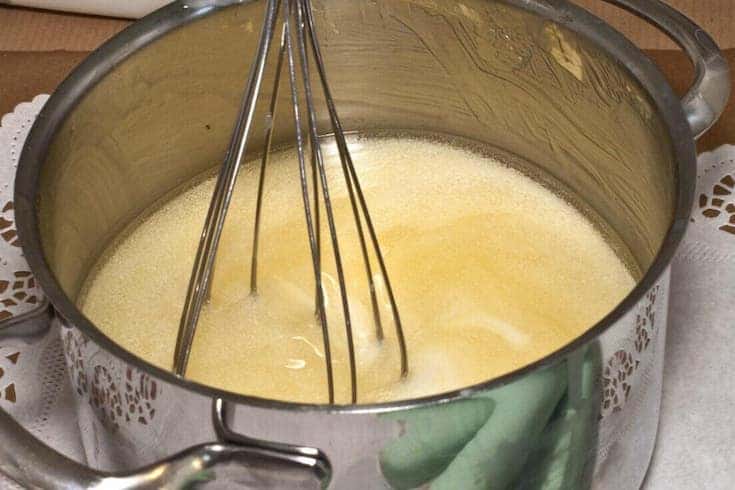whisking babassu oil in pot