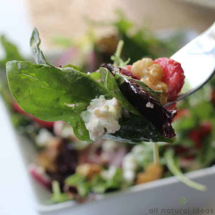 Easy spinach strawberry walnut salad on fork