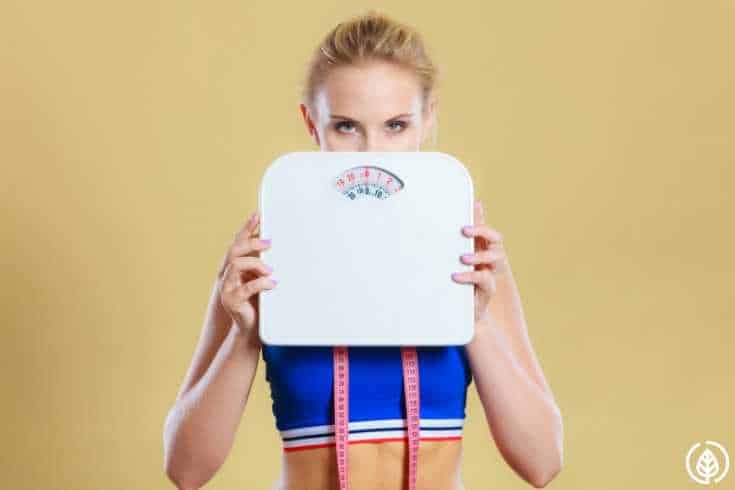 Woman holding scale